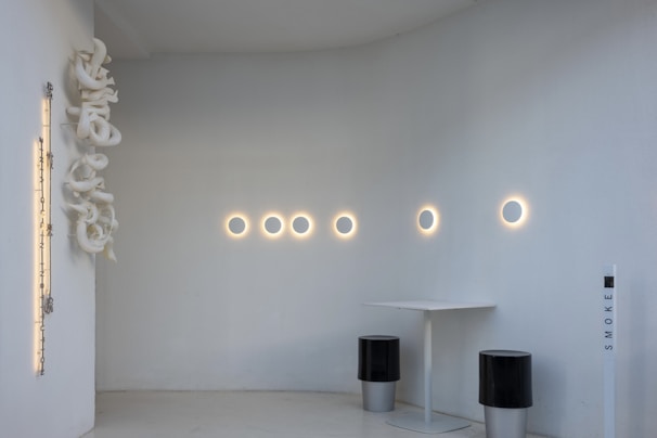 A sleek hypster air purifier glowing softly in a modern living room with natural light.