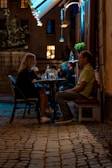 A couple sharing a meal at a cozy outdoor café.