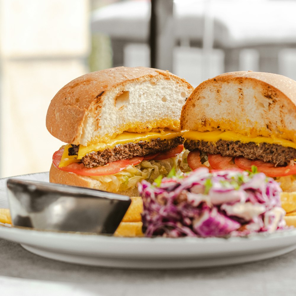 a plate with a sandwich and a side of coleslaw