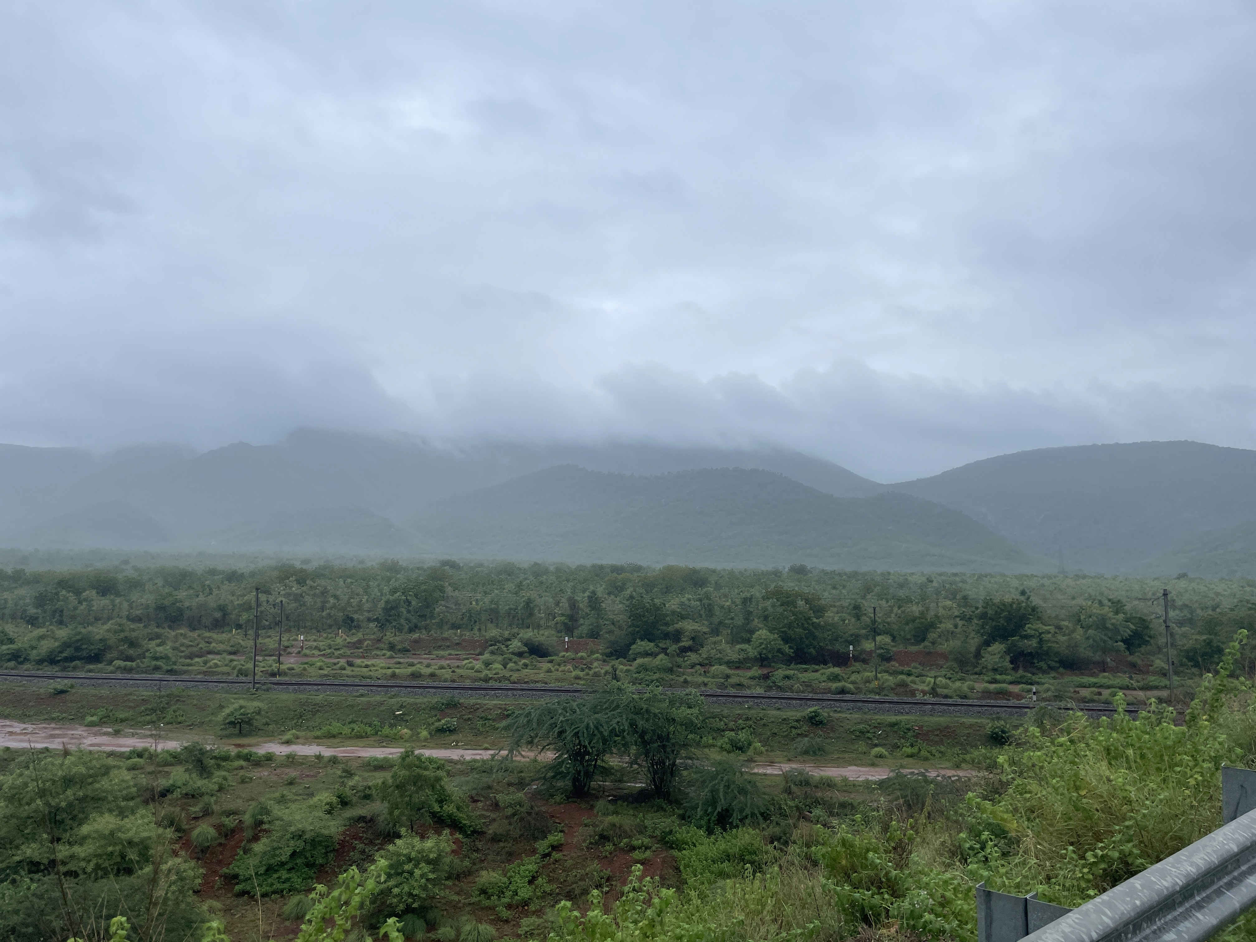 a view of a mountain range from a bridge