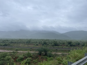 a view of a mountain range from a bridge