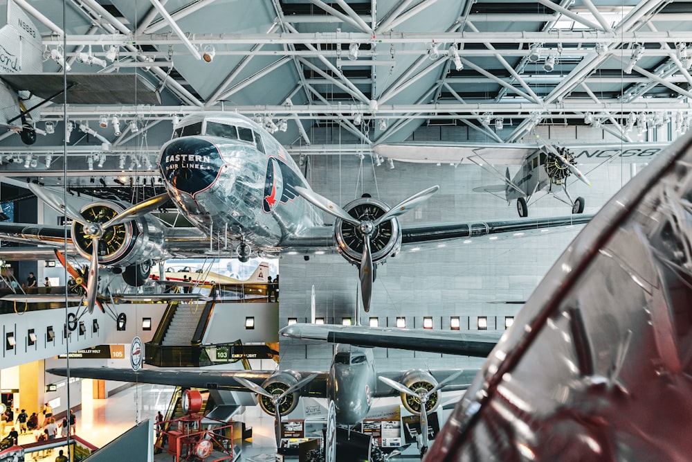 a large airplane hanging from the ceiling of a building