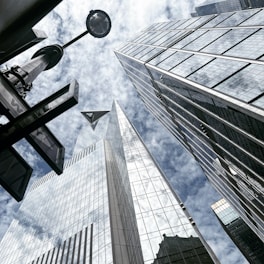 looking up at tall buildings in a city