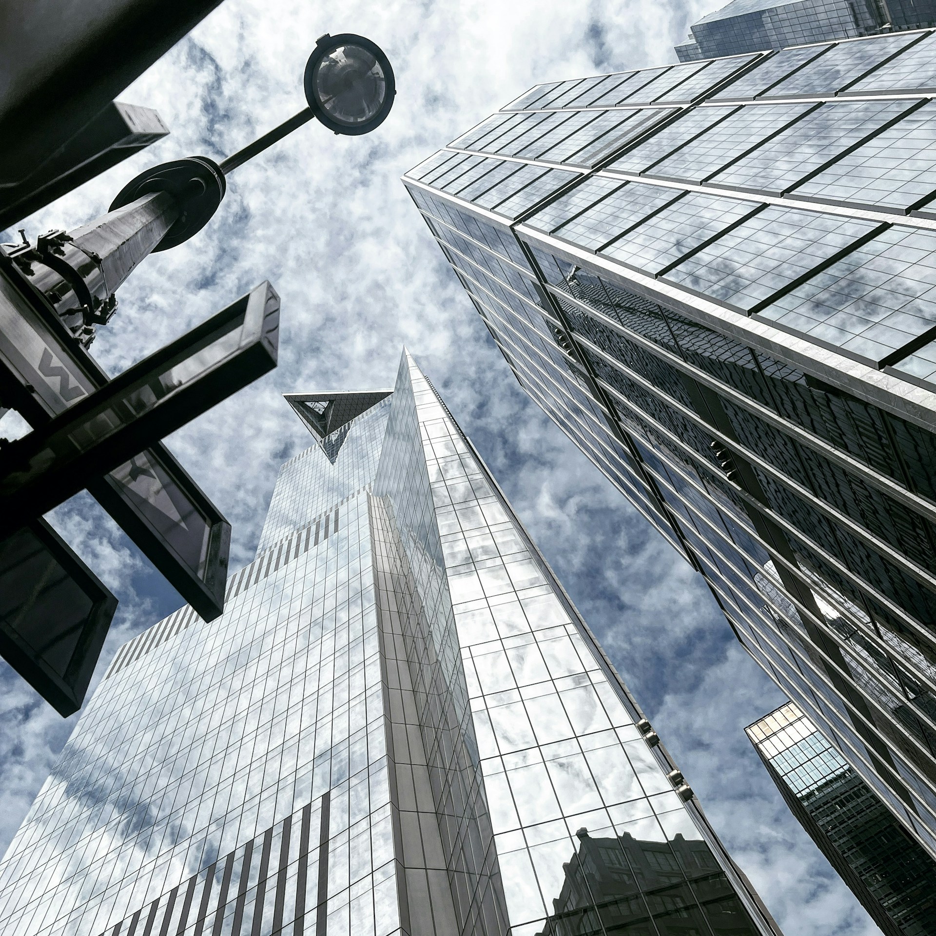 looking up at tall buildings in a city