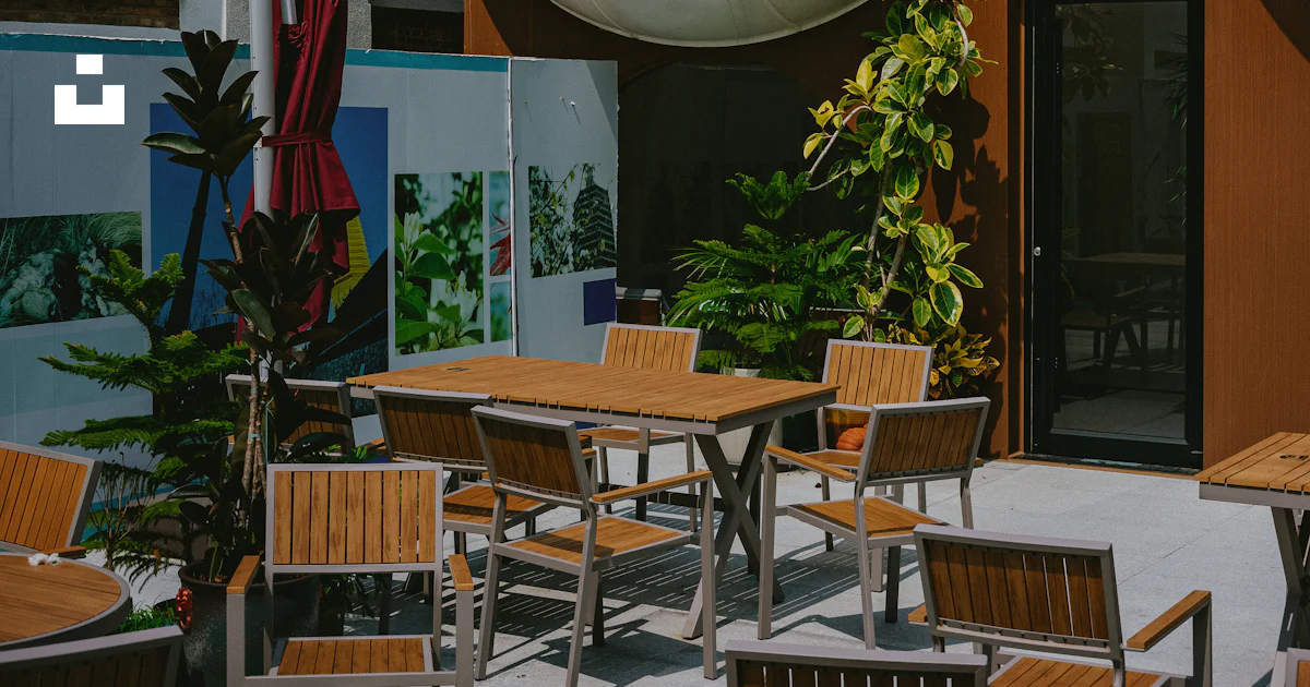 Table Group Design A group of tables and chairs outside of a building photo – Free ...