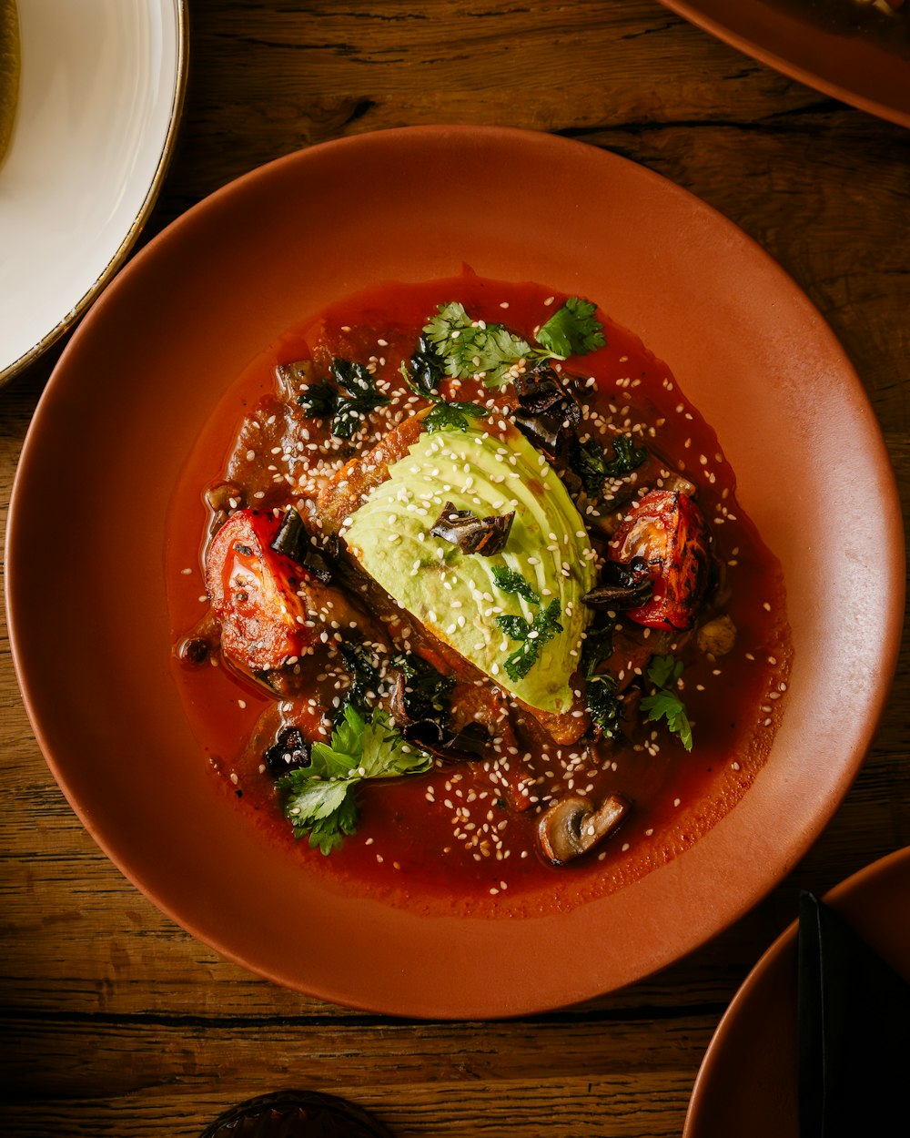 a plate of food on a wooden table