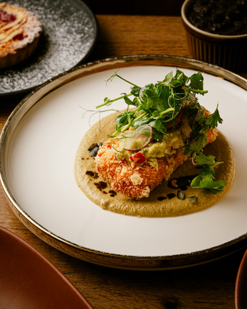 a plate of food on a wooden table