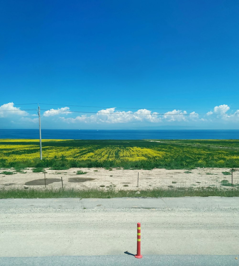 a view of a field from a car window