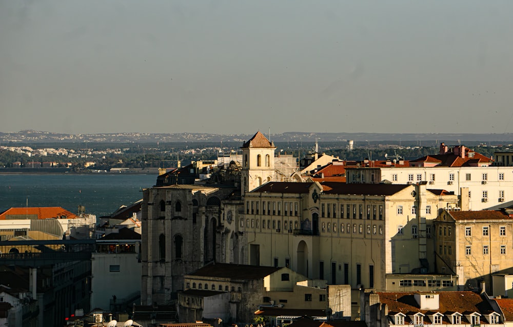 a view of a city with a body of water in the background