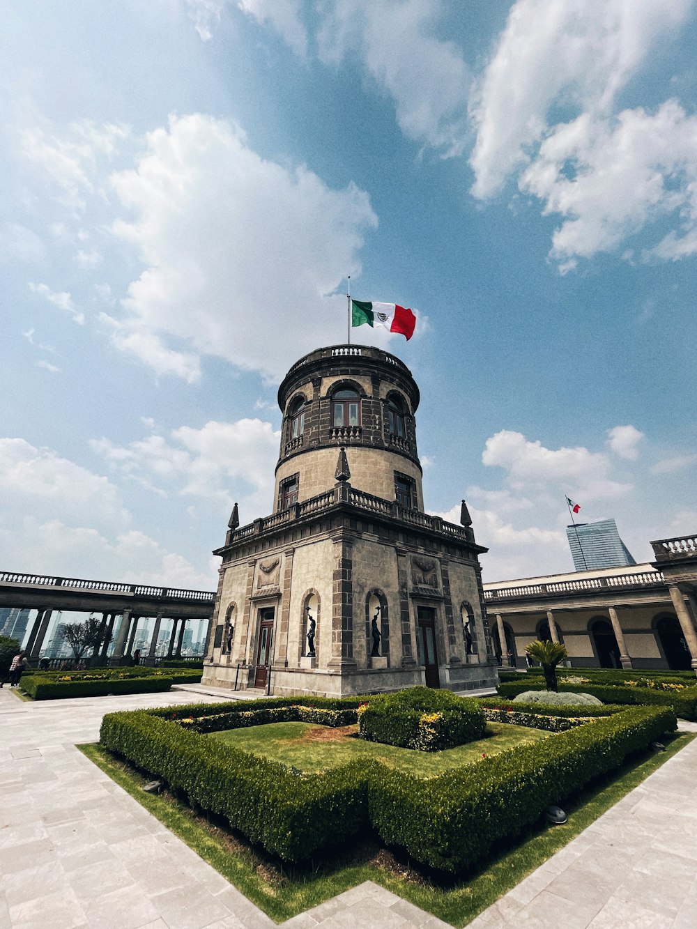 a large building with a flag on top of it