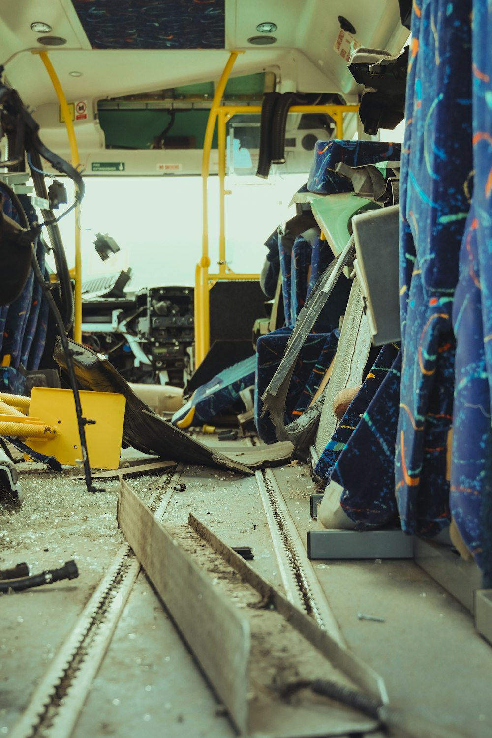 the inside of a bus with a bunch of junk on the floor