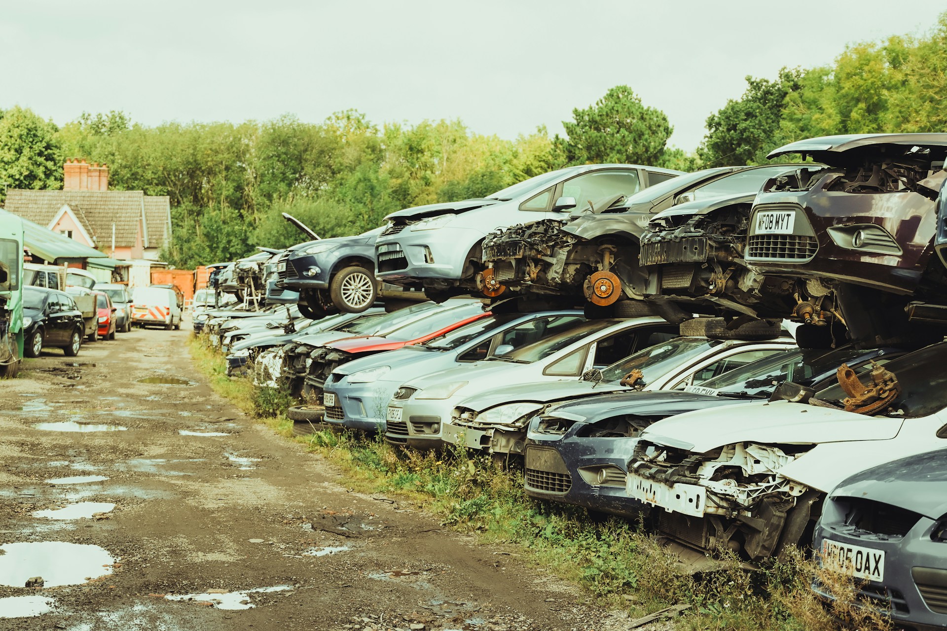 a bunch of cars that are sitting in the dirt