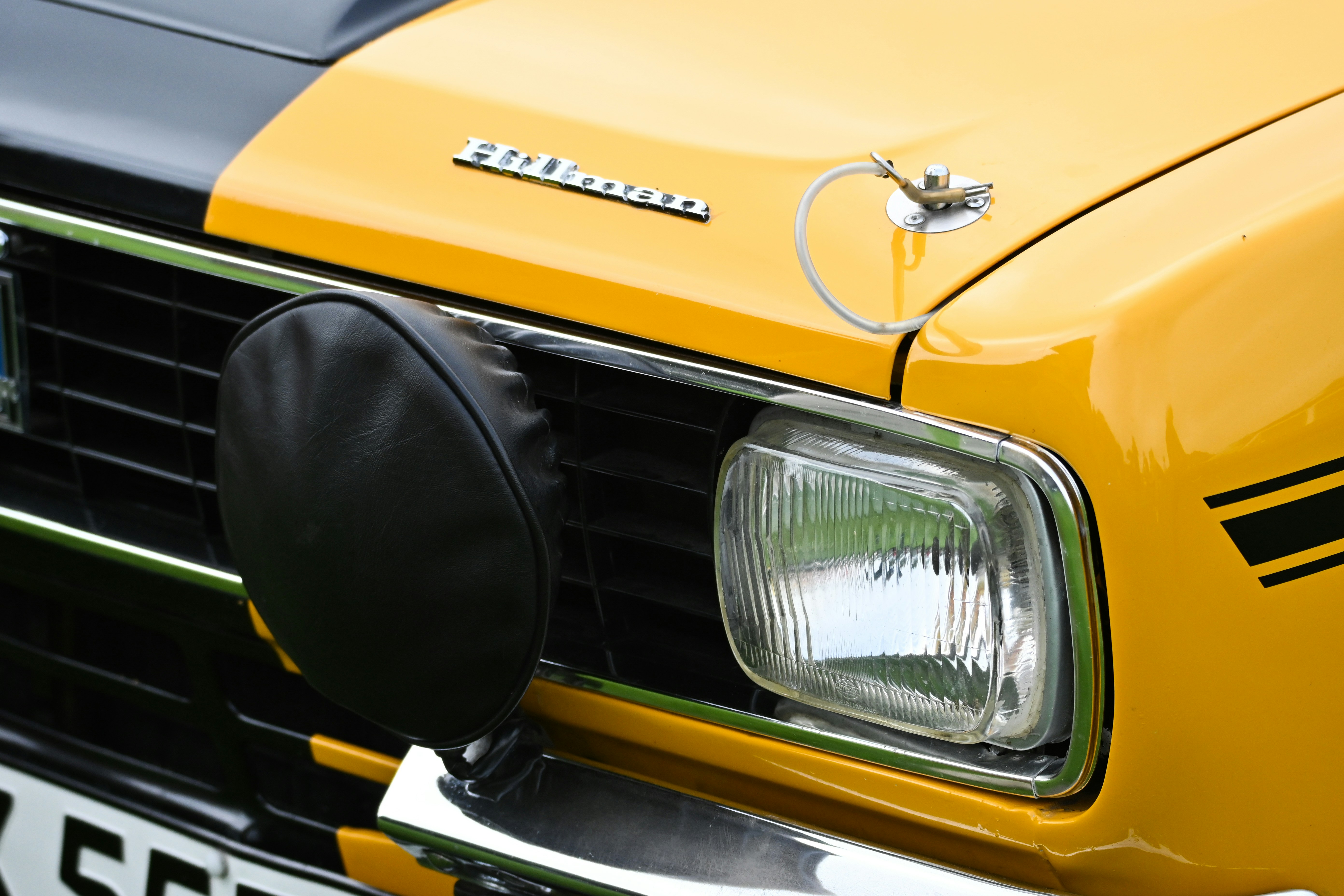 a close up of the front of a yellow truck