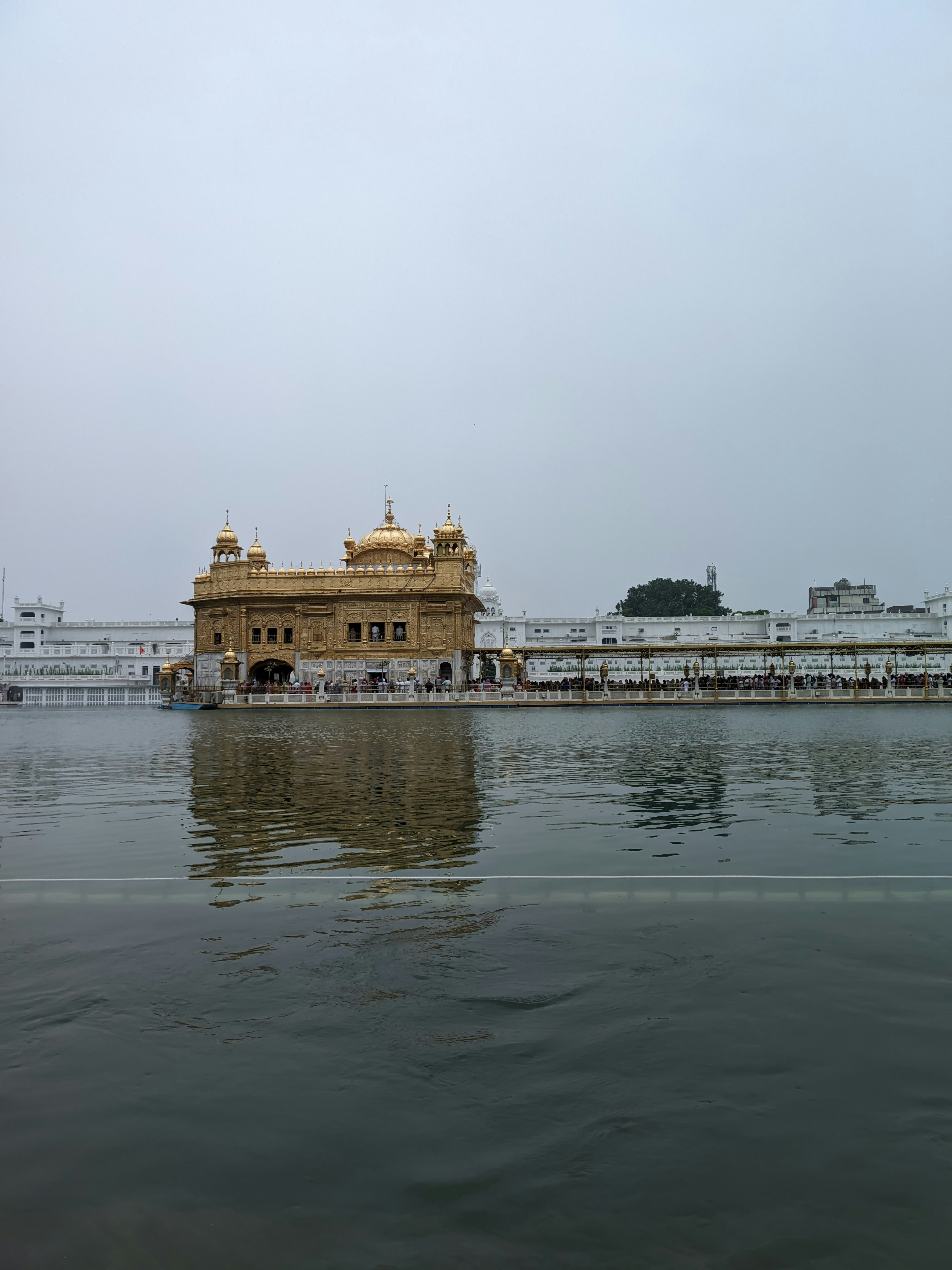 a large body of water with a building in the background