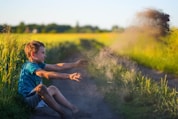 Children joyfully digging in the soil, their faces bright with curiosity and wonder.