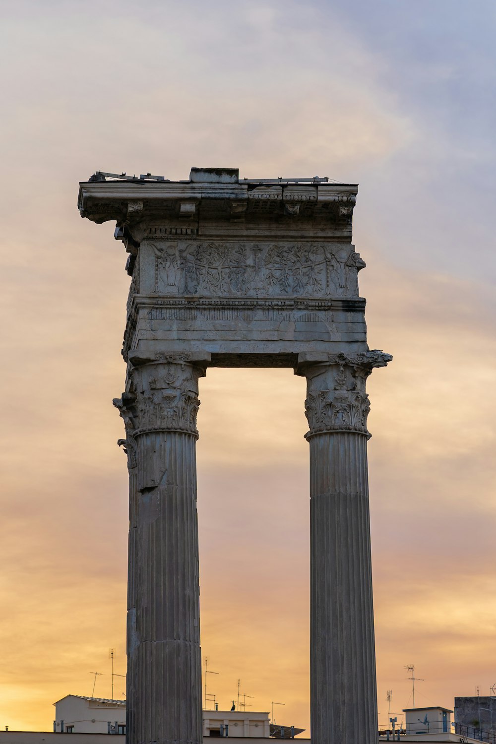 a very tall stone structure with two columns