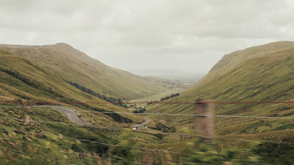 a view of a winding road in the mountains