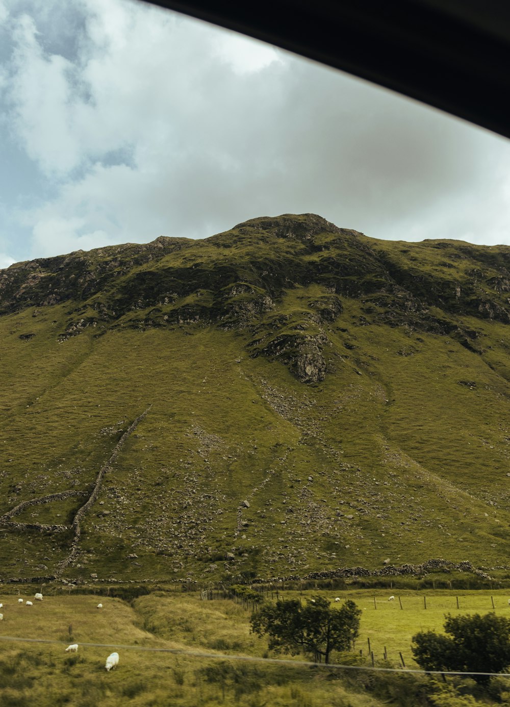 a view of a mountain from a car window