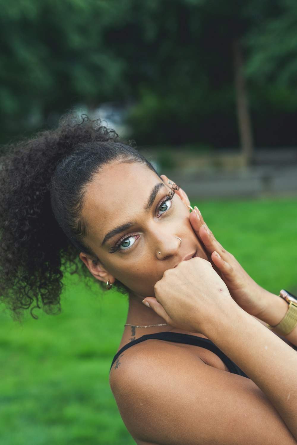 a woman with her hand on her face