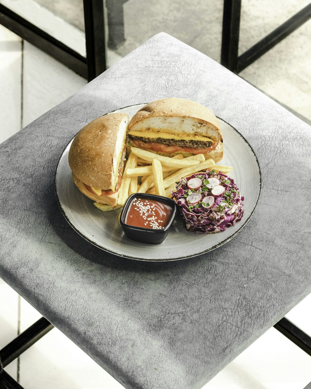 a plate with a sandwich and french fries on it