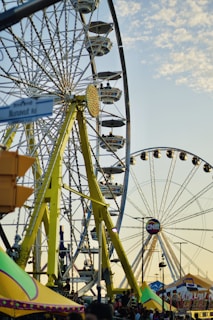 a ferris wheel at a carnival with a sky background