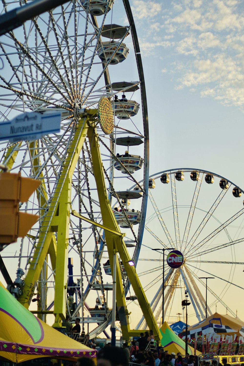 a ferris wheel at a carnival with a sky background