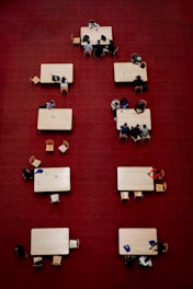 a group of people sitting at tables in a room