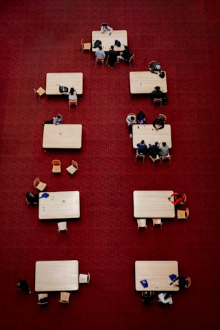 a group of people sitting at tables in a room