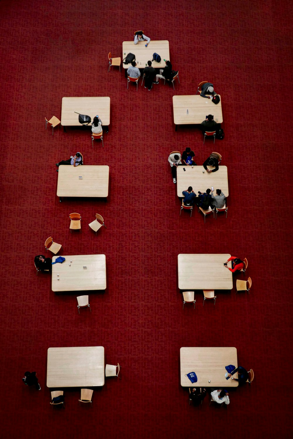 a group of people sitting at tables in a room