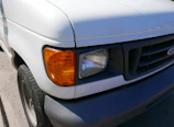 a close up of the front of a white truck