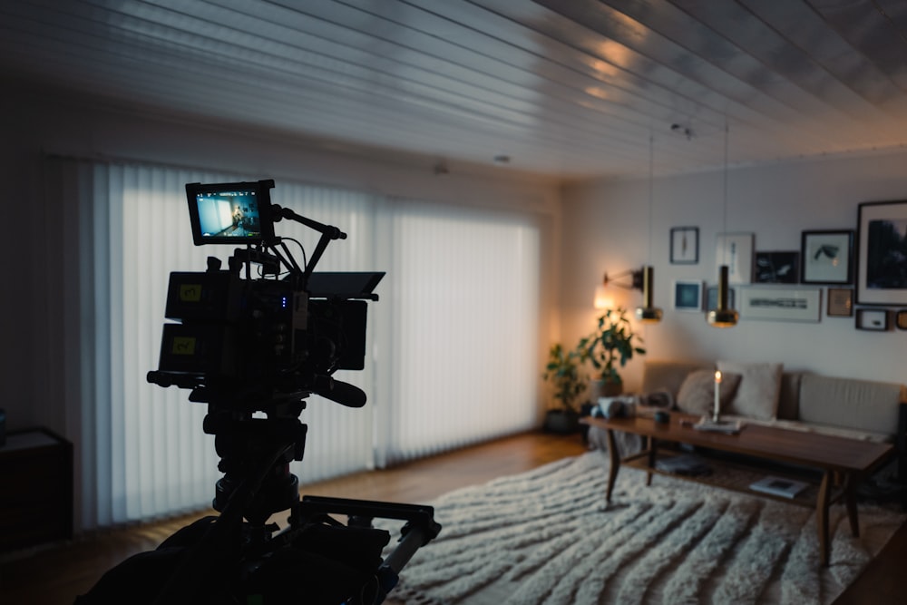 a camera set up on a tripod in a living room