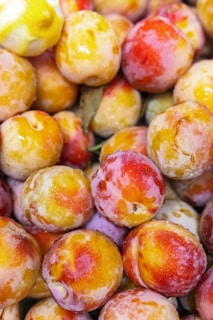 a close up of a bunch of plums