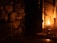 Cozy love room with medieval stone walls and soft candlelight ambiance.