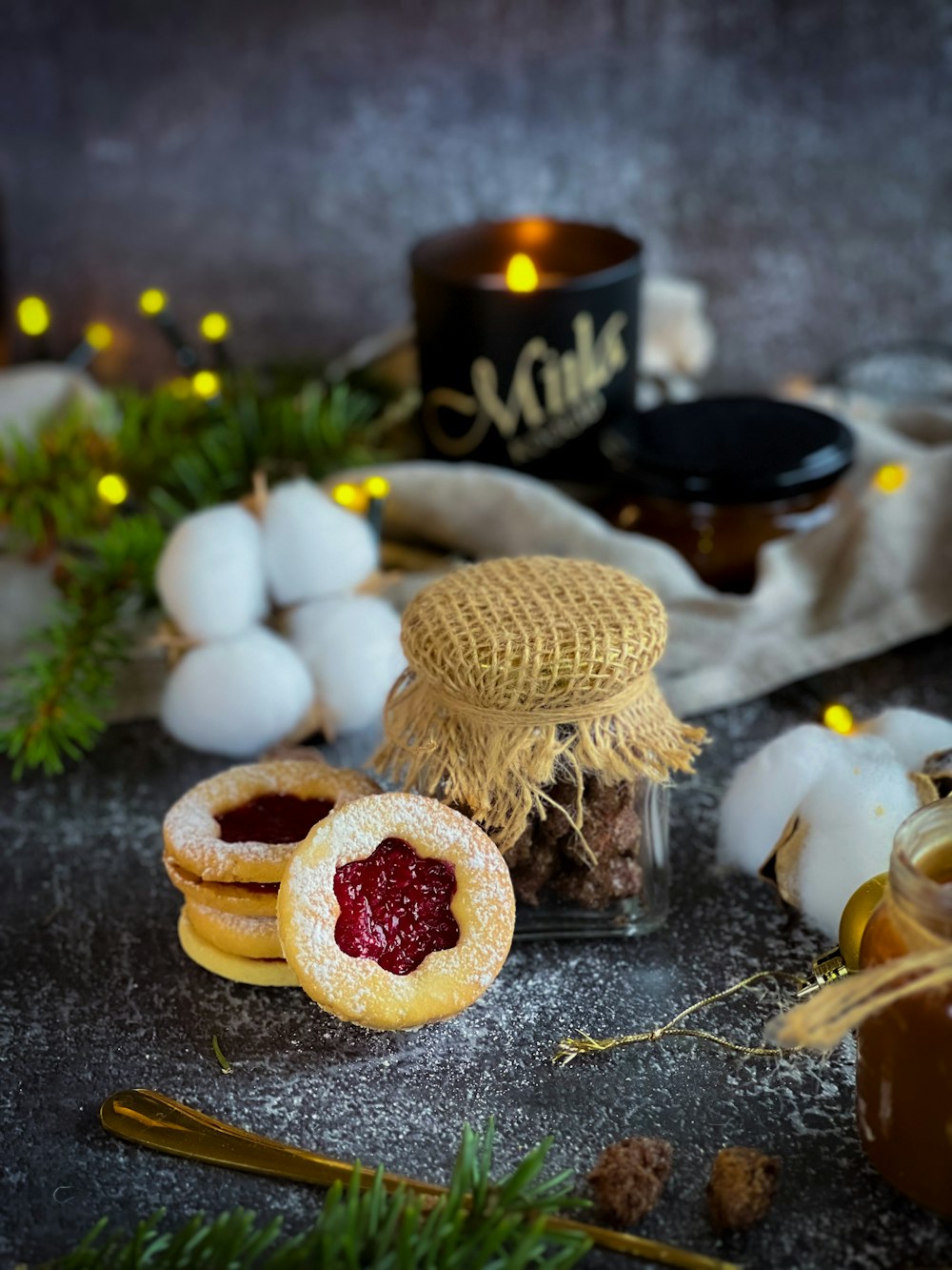 a table topped with cookies covered in jam