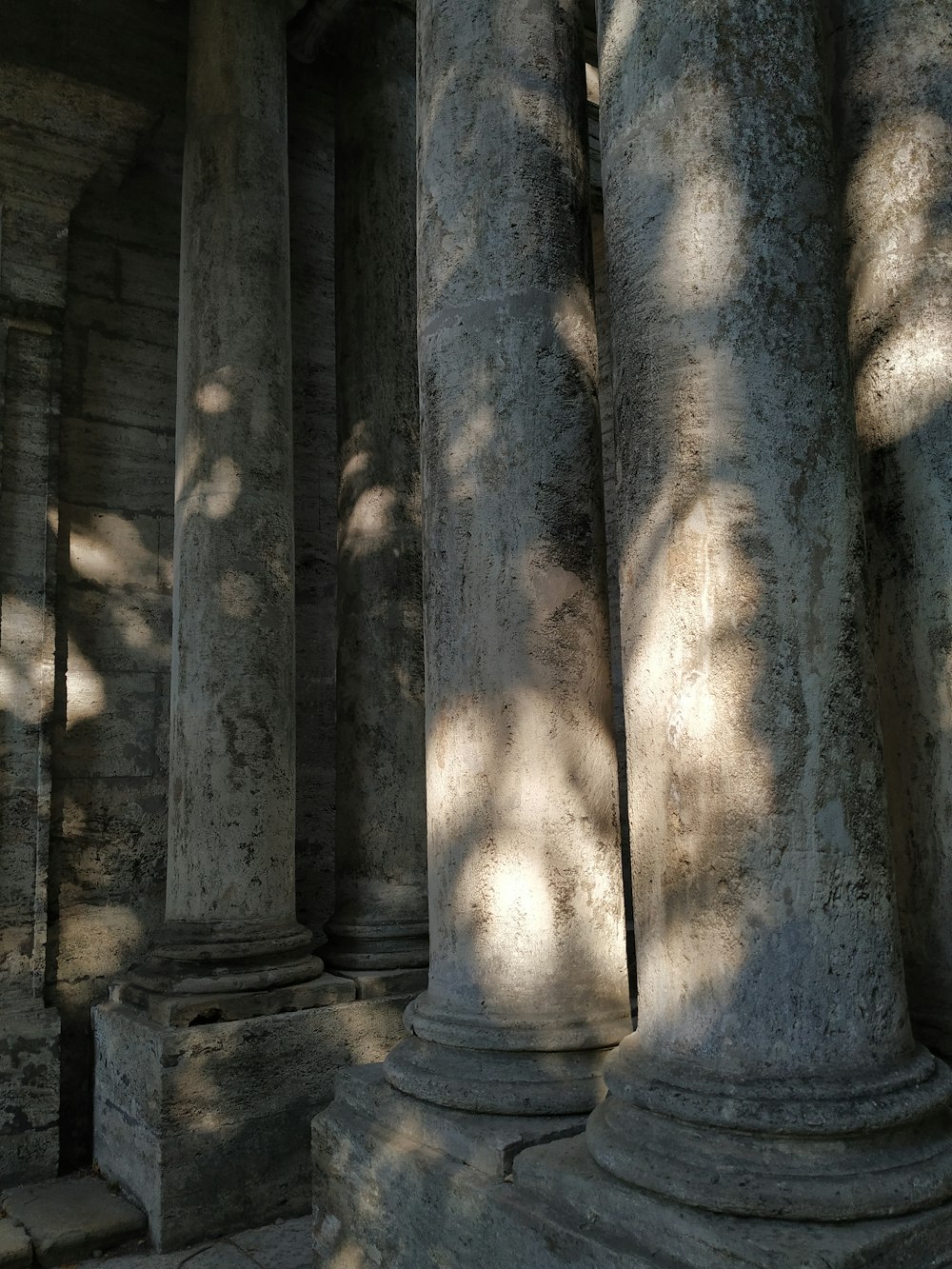 a row of stone pillars sitting next to each other