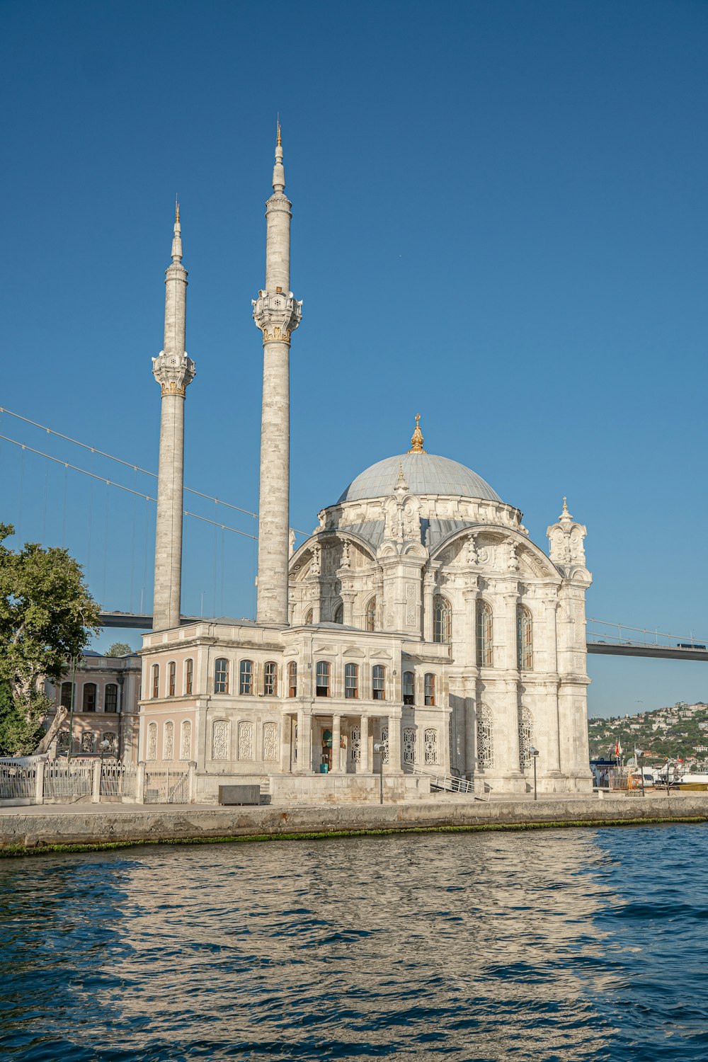 a large white building sitting on top of a body of water