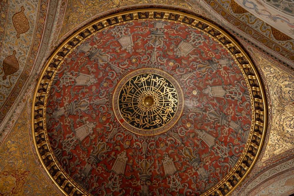 the ceiling of a building with a circular painting on it