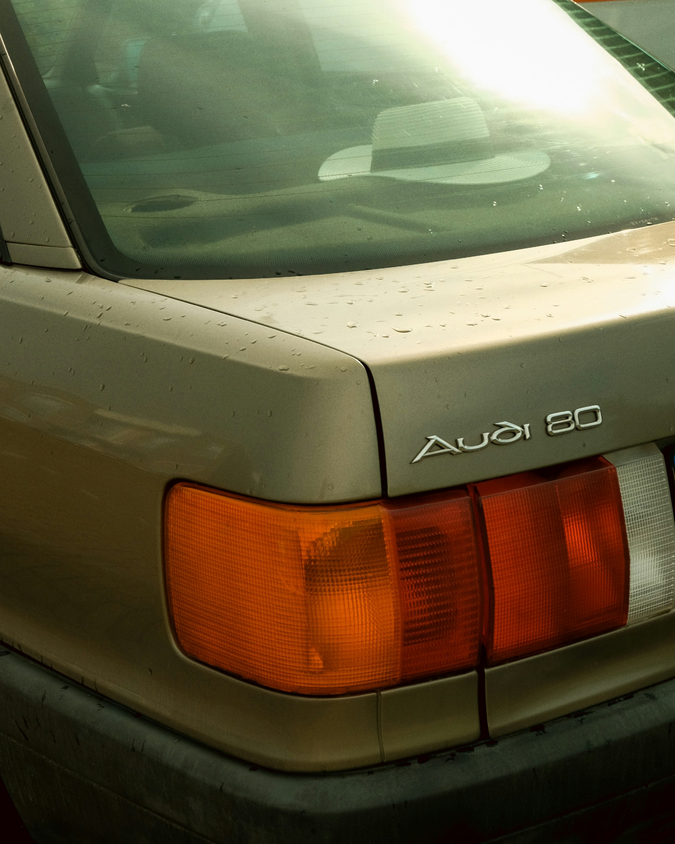 a silver car parked in a parking lot