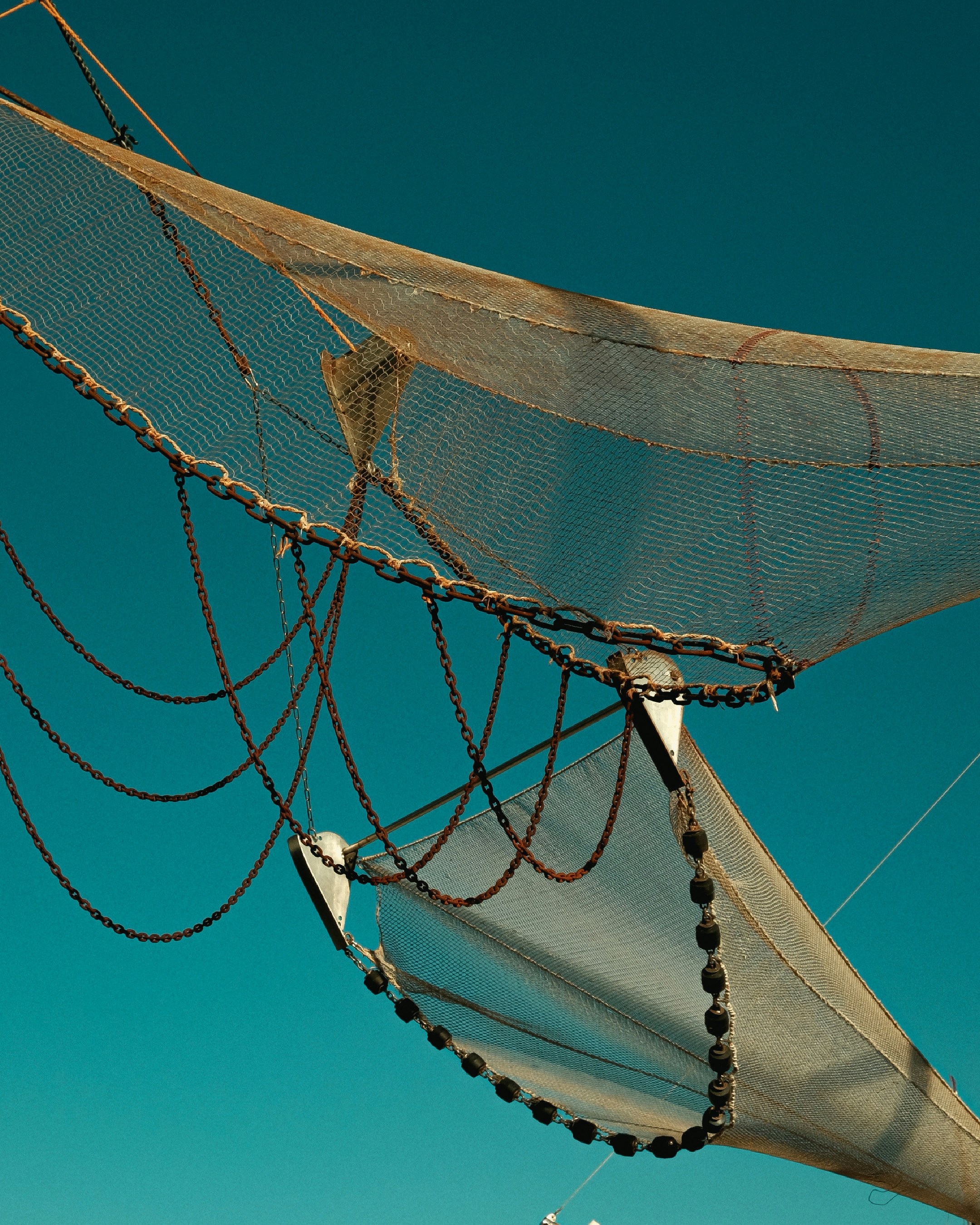 a sail boat with a net on top of it
