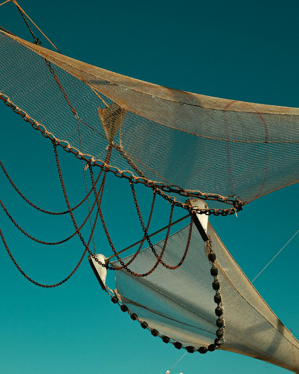 a sail boat with a net on top of it