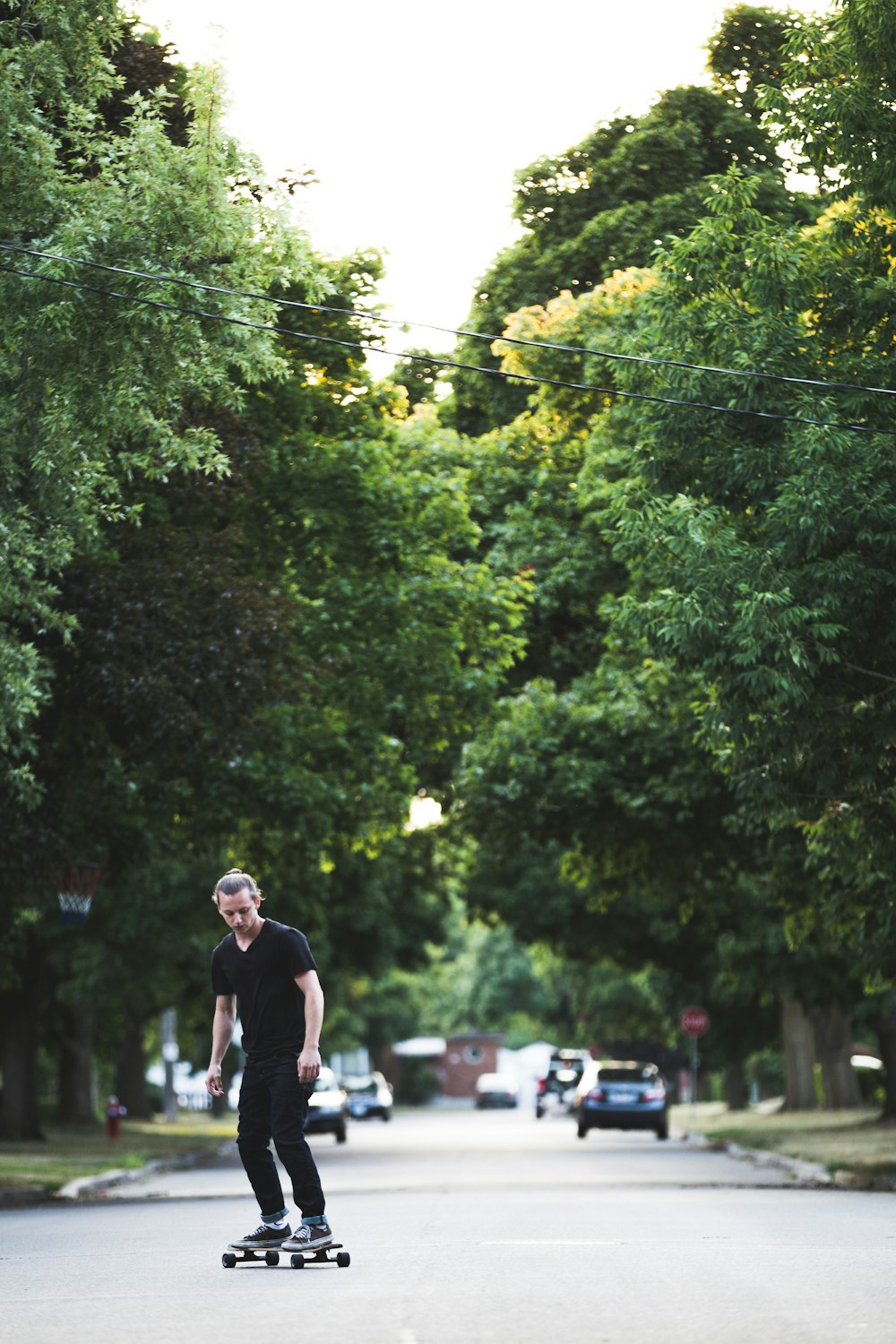 a man riding a skateboard down a street