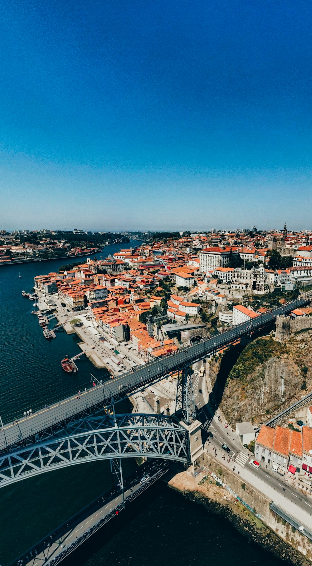 an aerial view of a city and a bridge