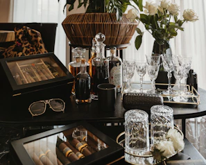 A collection of upscale crystal accessories arranged artfully on a marble tabletop