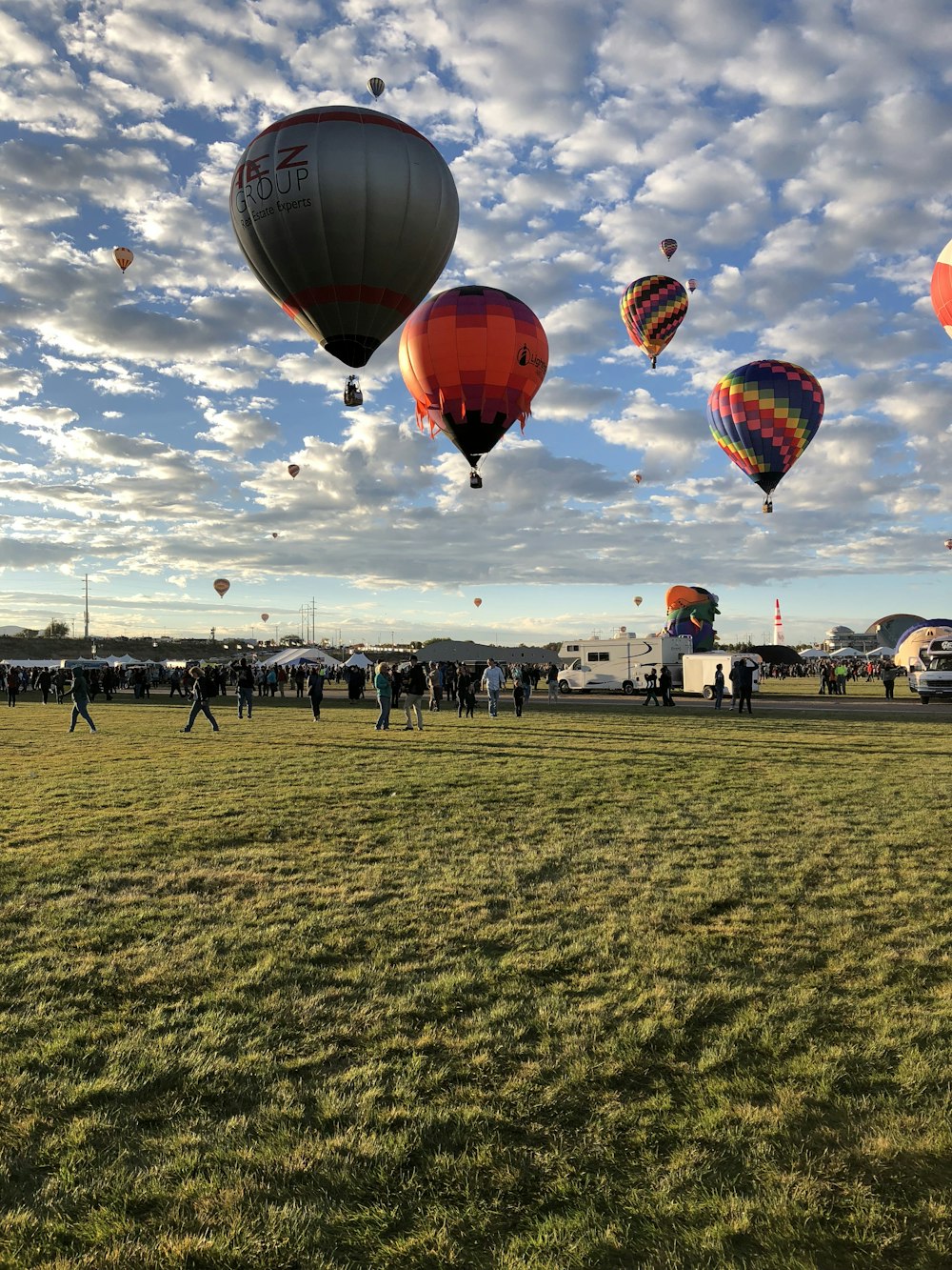 a bunch of hot air balloons flying in the sky