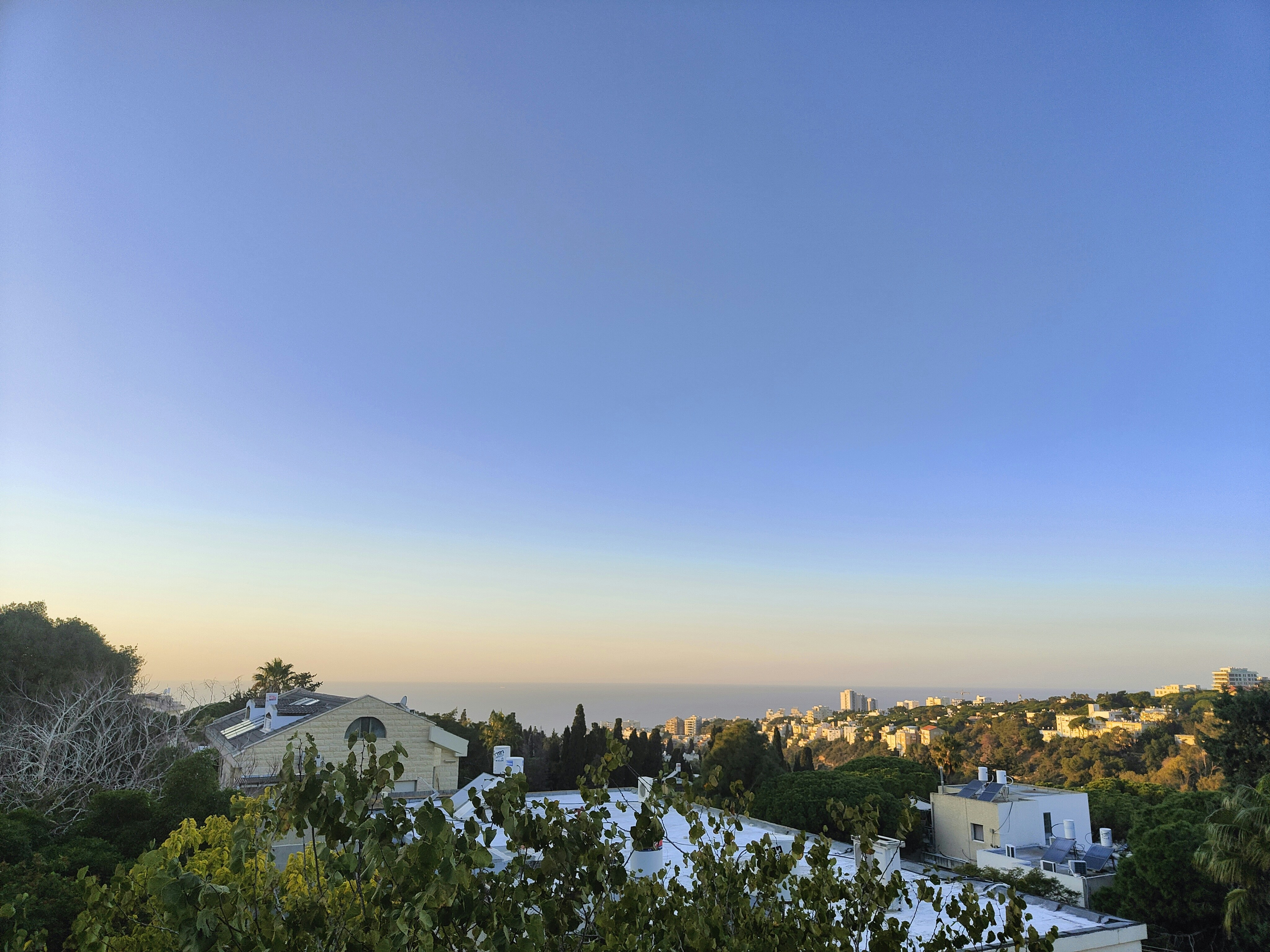 a view of a city from the top of a hill