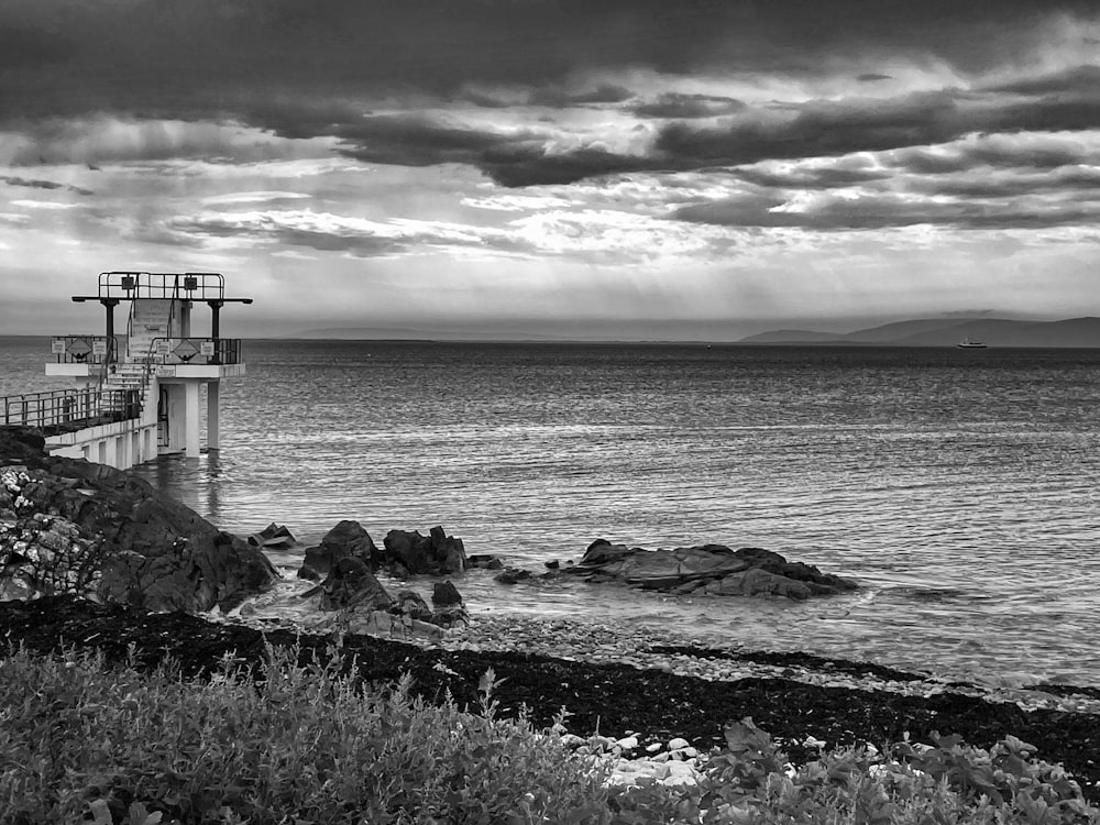 a black and white photo of a lighthouse