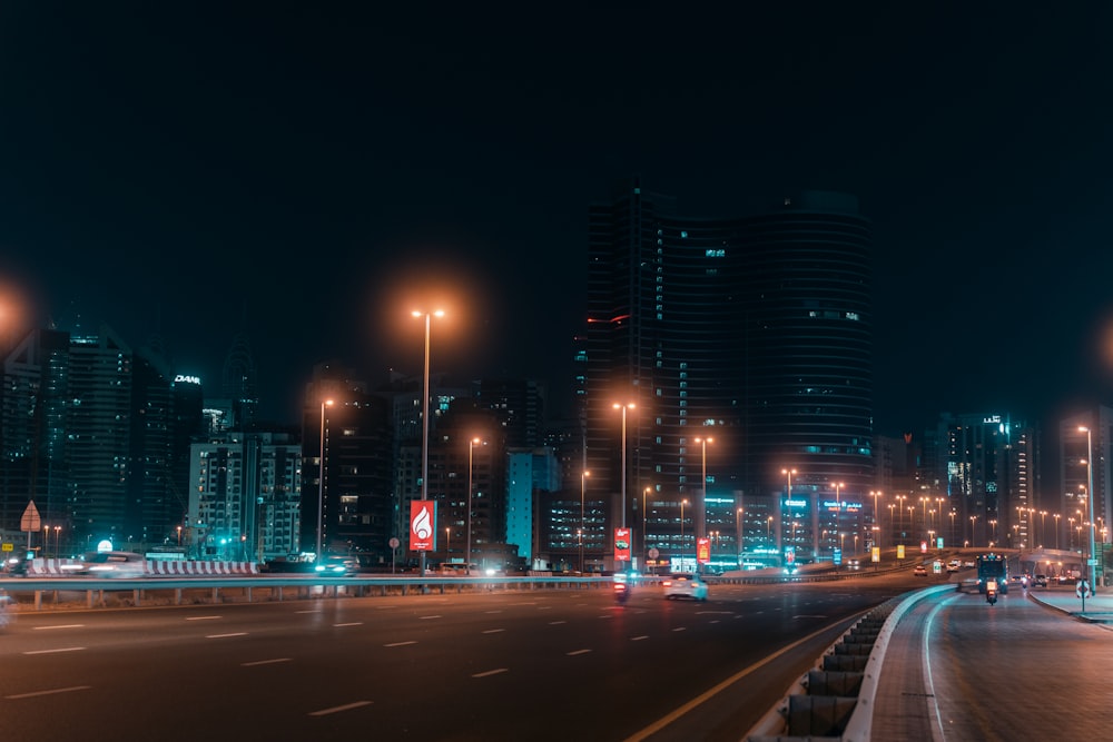 a city street at night with a lot of lights