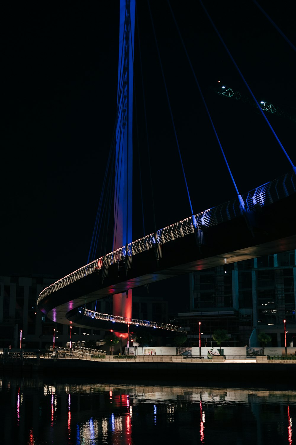 a bridge that is lit up at night