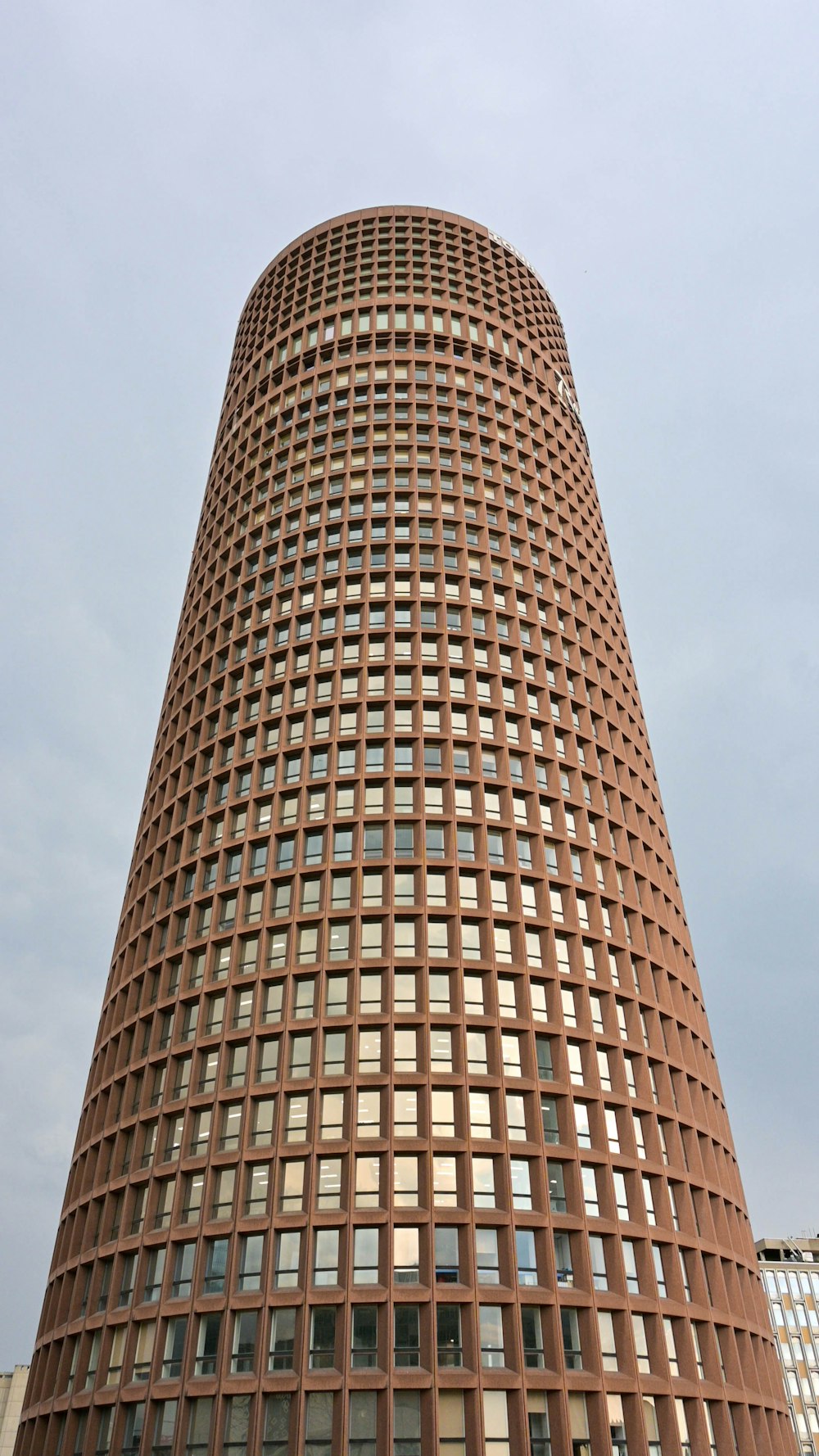 a very tall building with a clock on it's side