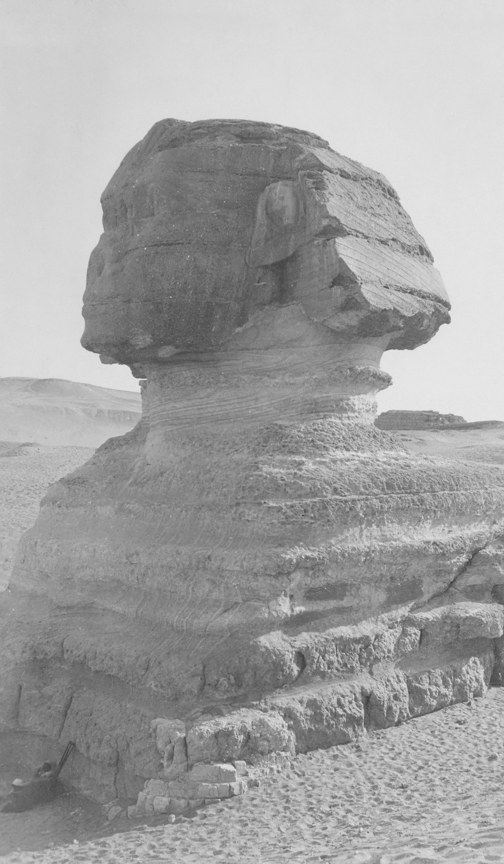 a large rock formation in the middle of a desert